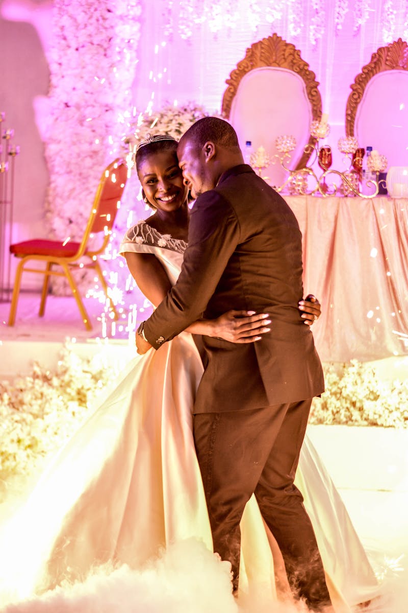 Happy bride and groom sharing a romantic first dance at their elegant wedding ceremony.
